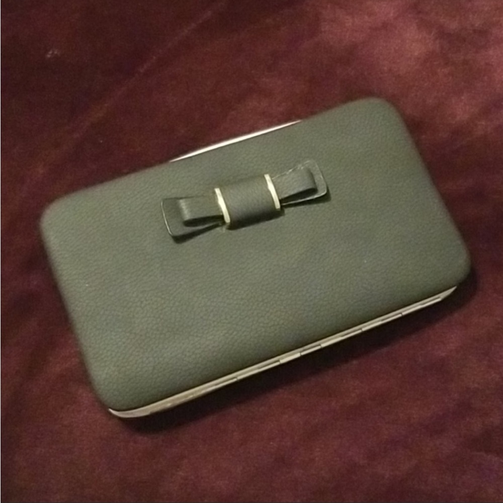 Lorna pidanlu designer wallet/wristlet.Black w/Bow on front and pink interior